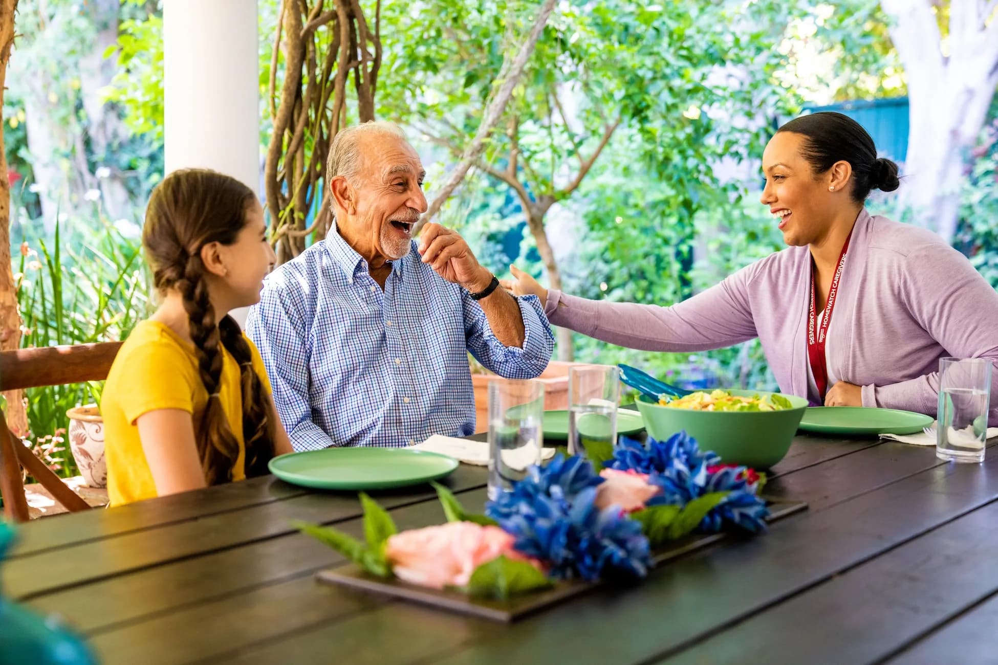 Compassionate caregiver spending quality time with elderly person and child – representing the warm, trusted care provided by True Care